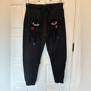 Roku Studio Tear Drip Rhinestone Eye Joggers Women’s Small Black streetwear c5